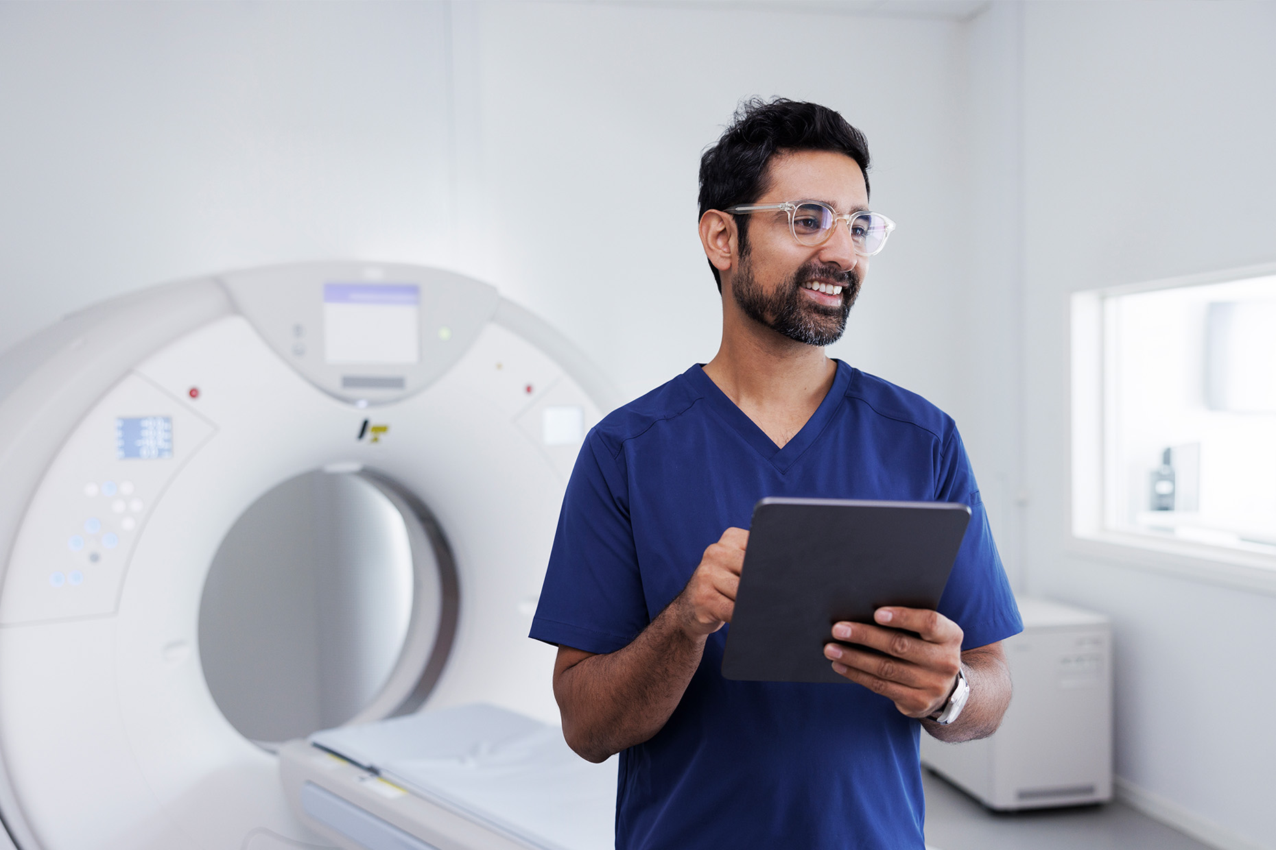 Male rad tech with MRI machine