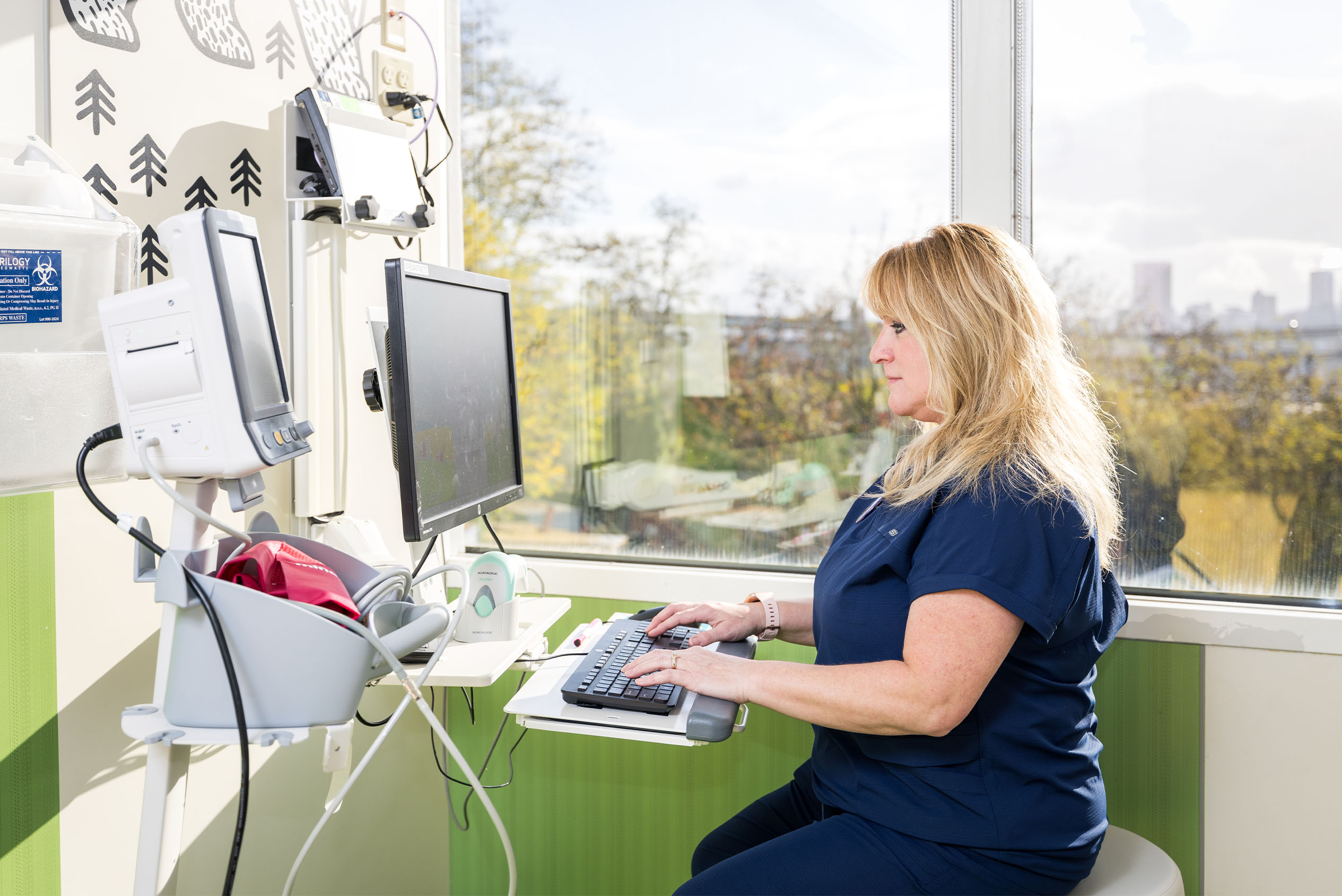 nursing assistant working on computer