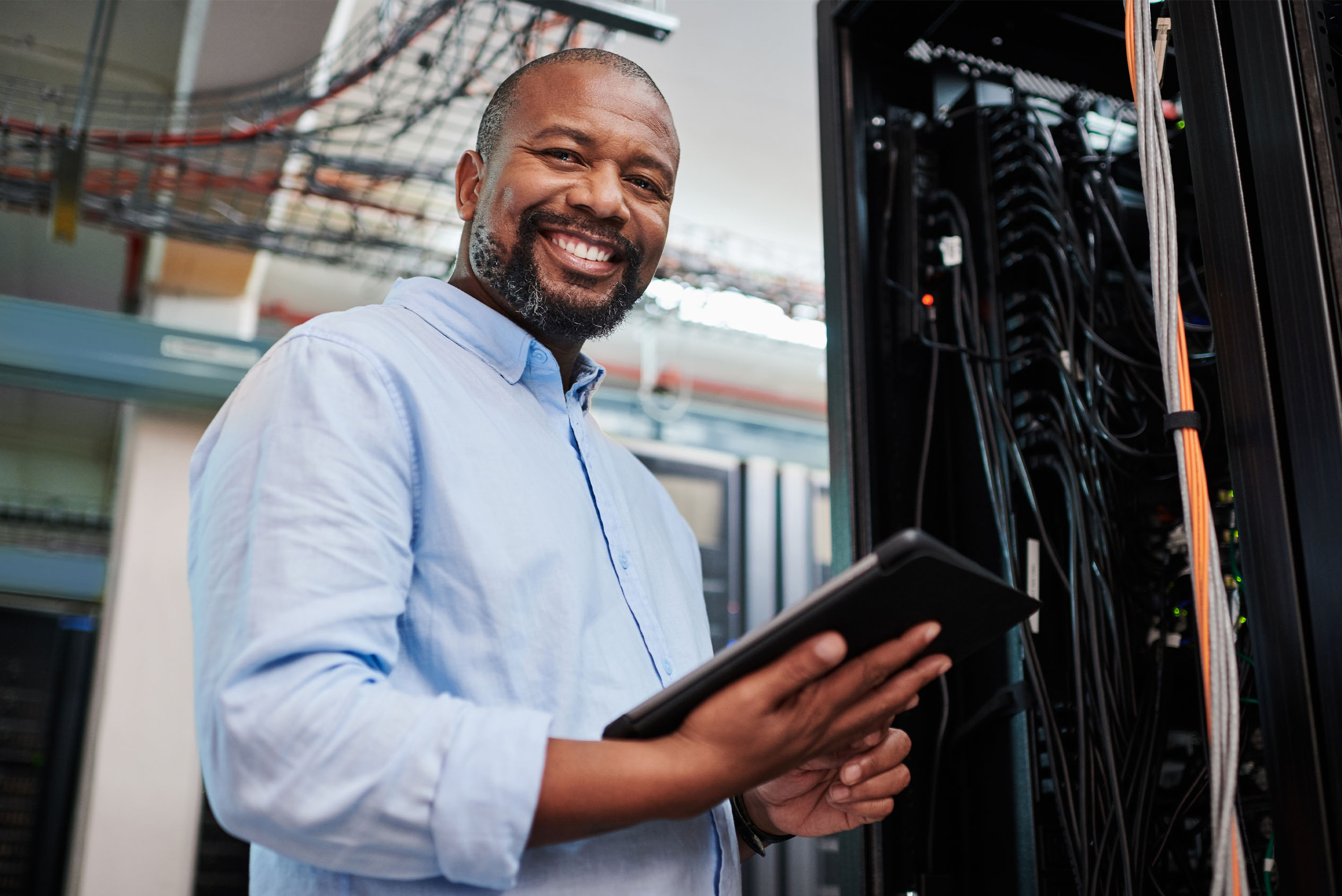 information technologist holding tablet