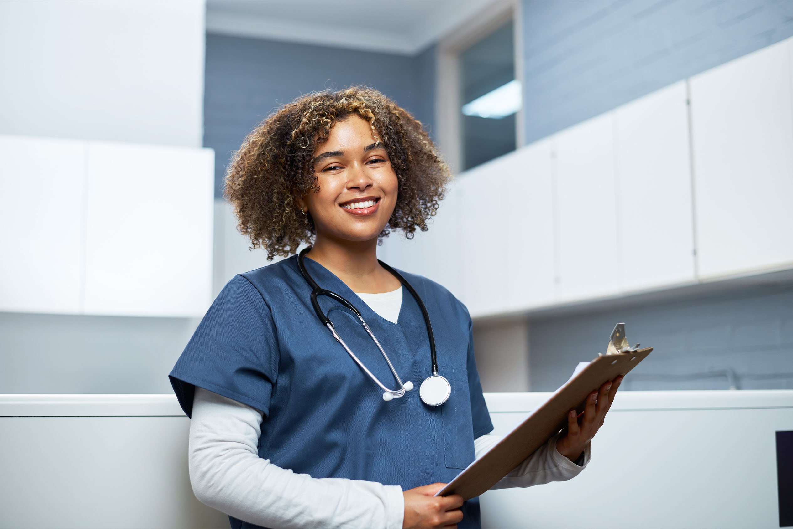 medical assistant holding notepad