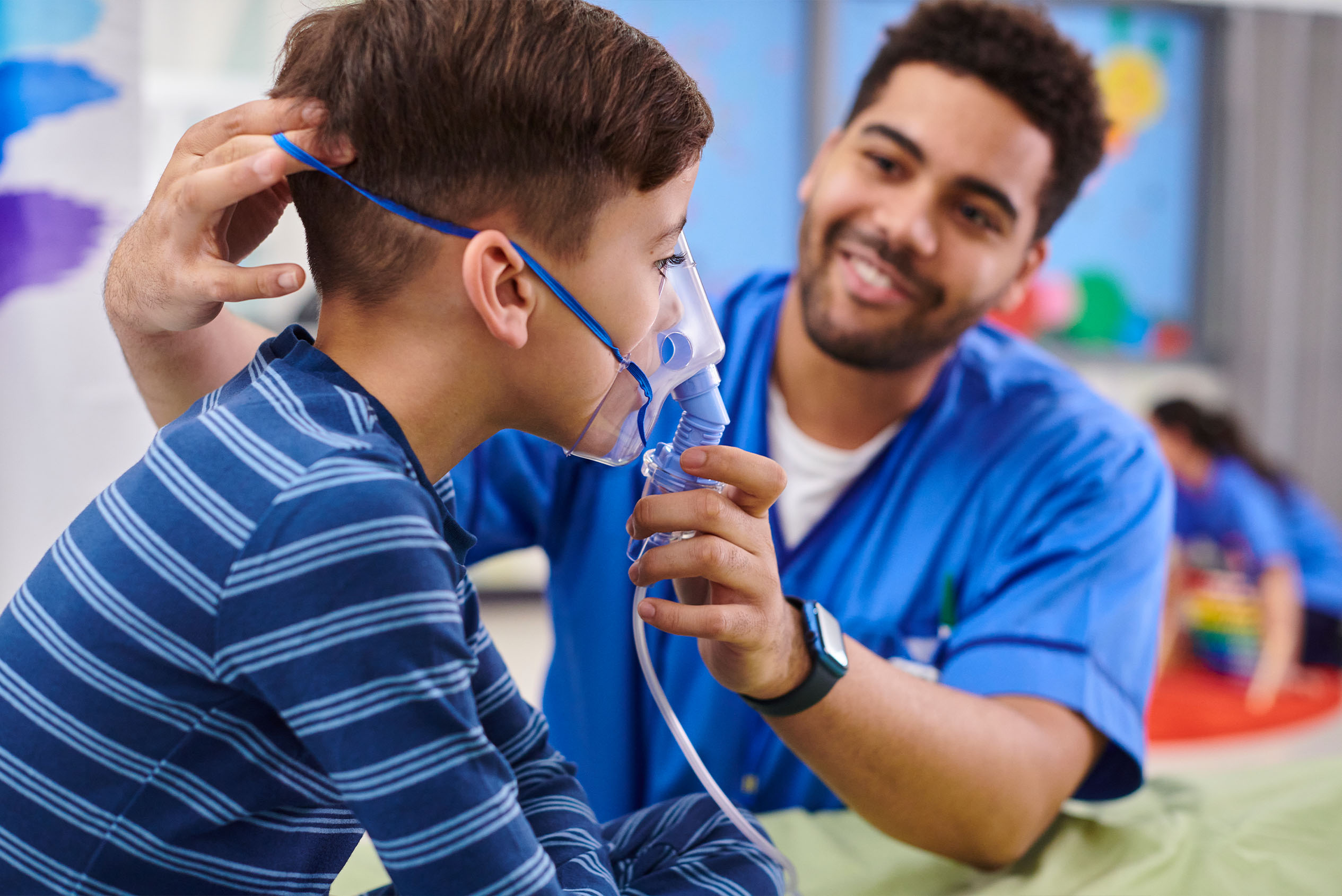 respiratory therapist helping patient