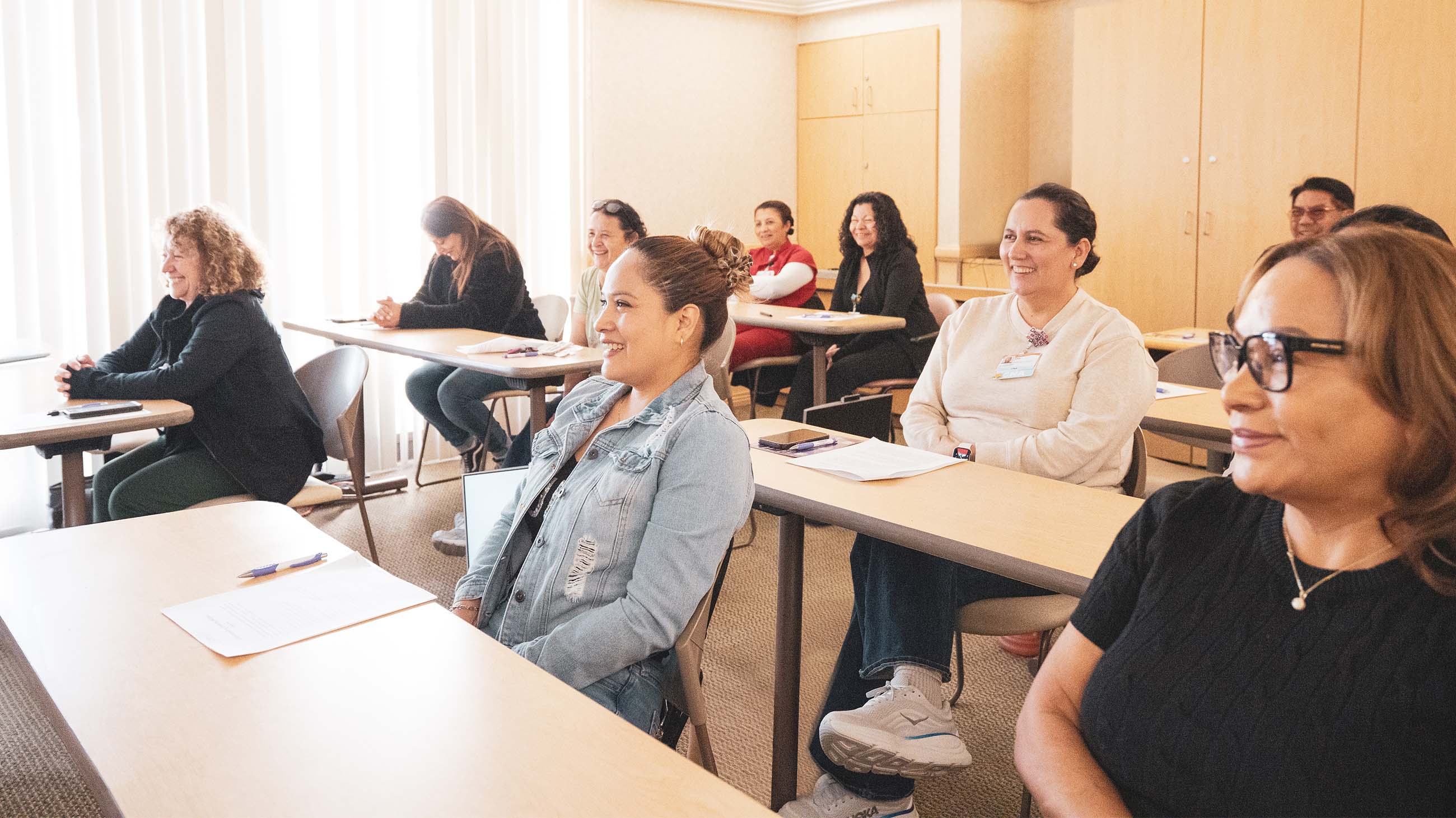 group of people listening in classroom