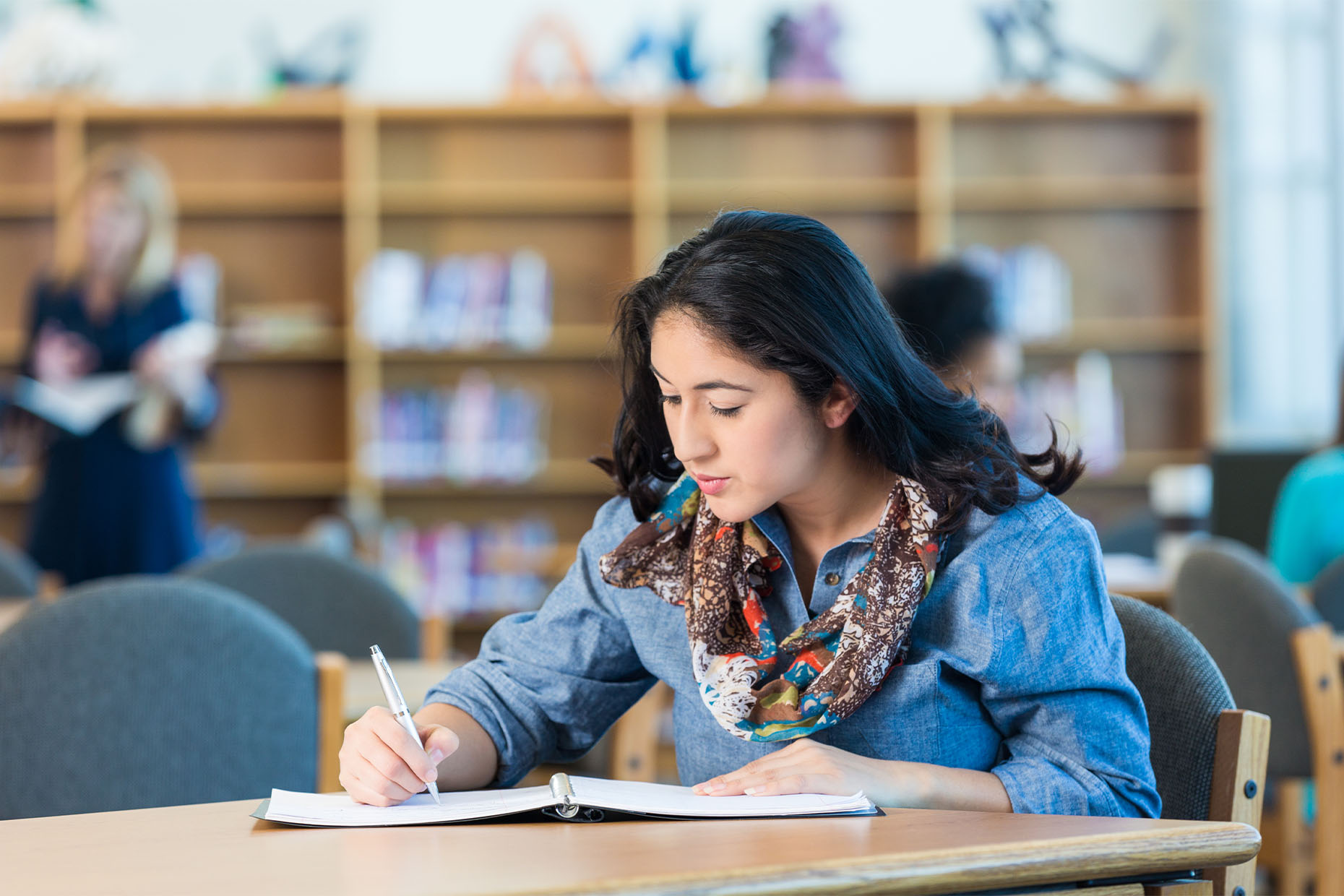 woman studying in library