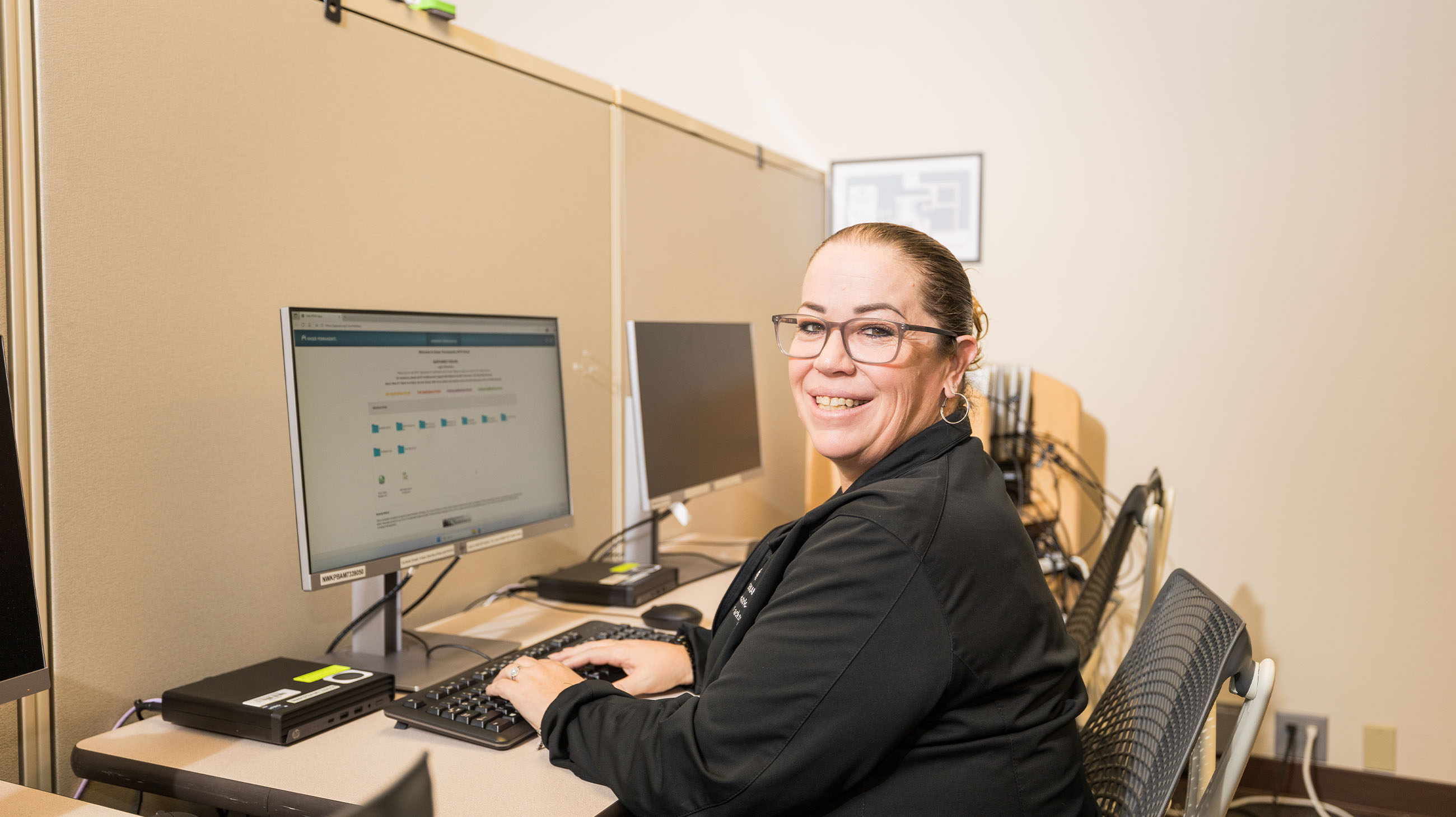 woman looking at file portal on desktop