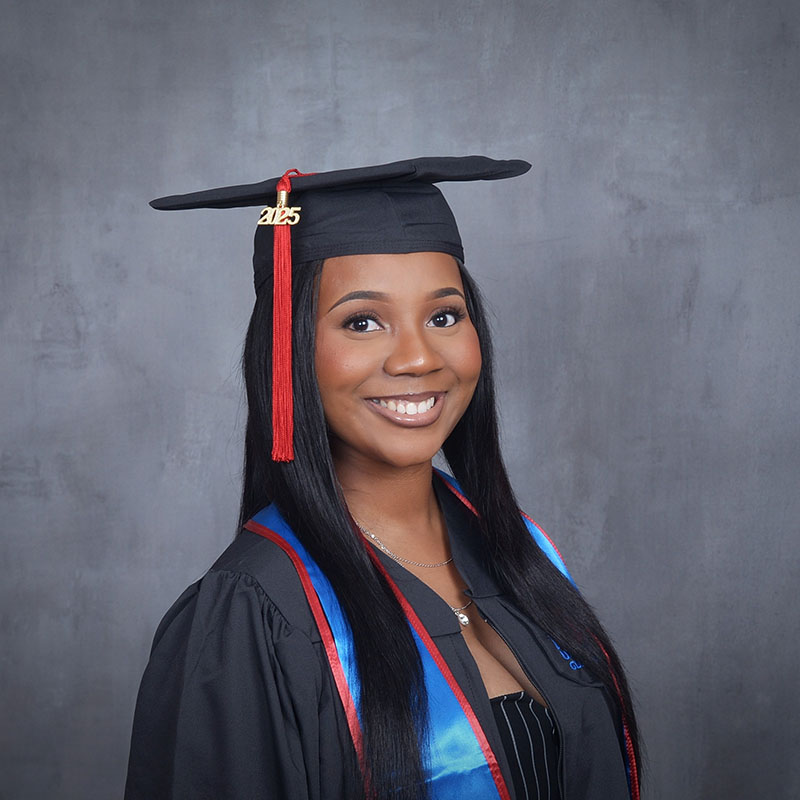 young man smiling with graduation cap