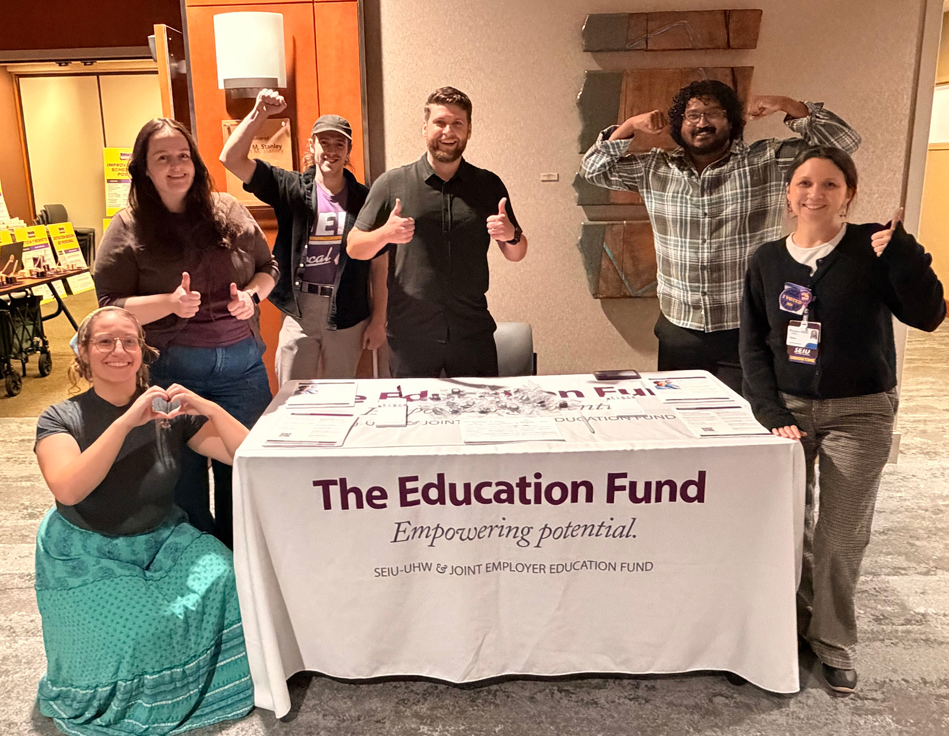 Education Fund Northwest Regional Coordinator, Michael Hale, poses with new eligible members at Providence St. Vincent.